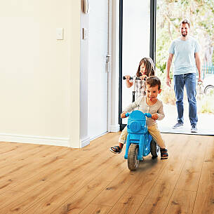 Excited Children Arriving Home With Father